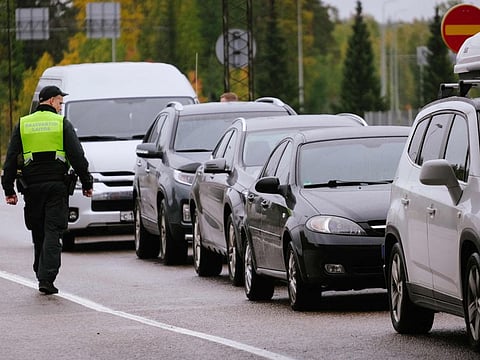 A border guard officer controls the vehicles entering Finland at the border checkpoint crossing in Vaalimaa, Finland, on the border with the Russian Federation on September 29, 2022.