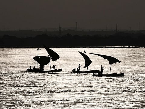 A view of boats silhouette, in the River Indus, following rains and floods during the monsoon season in Jamshoro, Pakistan, on September 20, 2022.