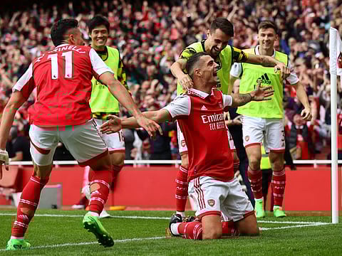 Arsenal's Granit Xhaka celebrates scoring their third goal against Tottenham with Fabio Vieira and Gabriel Martinelli.