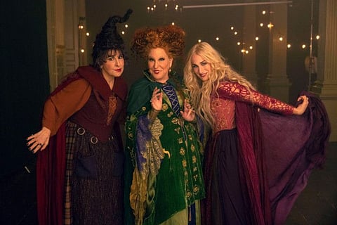 This image released by Disney shows, from left, Kathy Najimy as Mary Sanderson, Bette Midler as Winifred Sanderson, and Sarah Jessica Parker as Sarah Sanderson in "Hocus Pocus 2."