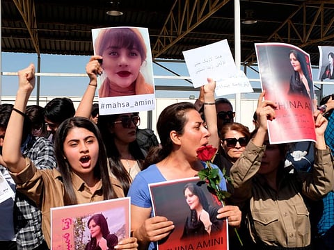 Protesters gather outside the UN headquarters in Arbil to protest the death of Masha Amini. Fearing an ethnic uprising and in a show of power, Iran fired missiles and drones at targets in neighbouring northern Iraq’s Kurdish region this week after accusing Iranian Kurdish dissidents of being involved in the unrest.