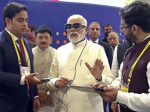 Prime Minister Narendra Modi with Chairman of Reliance Jio, Akash Ambani during the inspection of an exhibition prior to the launch of 5G services, at Pragati Maidan, in New Delhi on Saturday.