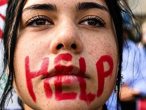 A woman takes part in a protest on October 1, 2022 in Rome, in solidarity with Kurdish woman Mahsa Amini in Iran.