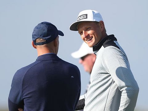 Dubai-based Adrian Meronk (right) chatting with amateur partner Andiy Shevchenko at the Alfred Dunhill Links Championship in Scotland.