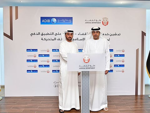 Abu Dhabi Judicial Department (ADJD) and Abu Dhabi Islamic Bank (ADIB) officials announce the launch of the new fee payment service.