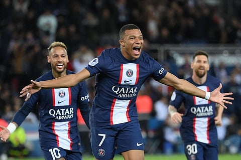 Paris Saint-Germain's French forward Kylian Mbappe celebrates after scoring a goal during the French L1 football match against Nice at The Parc des Princes Stadium in Paris.