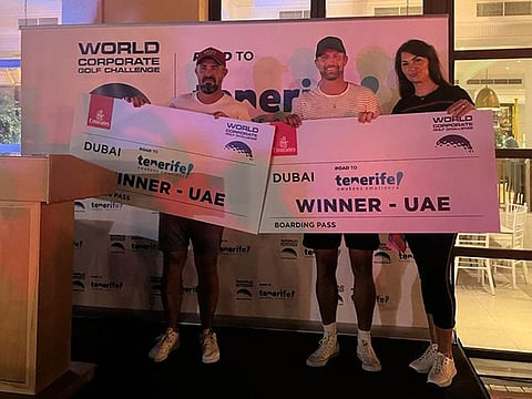 Winners of the World Corporate Golf Challenge with organiser Marta Biswas (right).