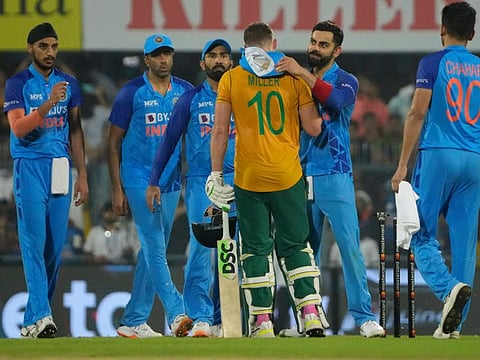 India's Virat Kohli (second right) congratulates South Africa's David Miller on scoring a century during the second T20 cricket match in Guwahati, India. Kohli could be rested for tomorrow's final match of the three-game series.