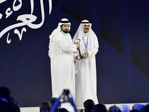Sheikh Ahmed bin Mohammed bin Rashid Al Maktoum (left) presenting the Media Personality of the Year Award to Khalid bin Hamad Al Malik
