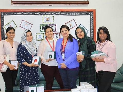 Teachers with the gifts presented to them at Apple International Community School in Dubai