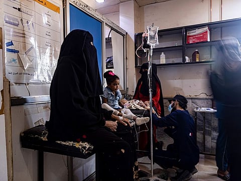 Medics treat a child diagnosed with cholera in a hospital in Deir Al Zour, Syria.