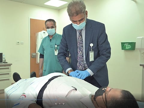 Dr Aftab Ahmed Bhati, Consultant urologist at Tawam Hospital in Al Ain checking the patient
