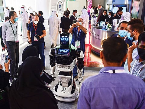 Visitors interact with a robot at the last Gitex edition