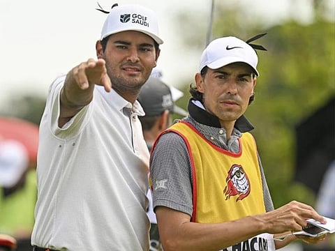 Round two leader Eugenio Chacarra (left) from Spain with his caddy during the LIV Golf Invitational Bangkok at Stonehill Golf Club in Pathum Thani, Thailand.