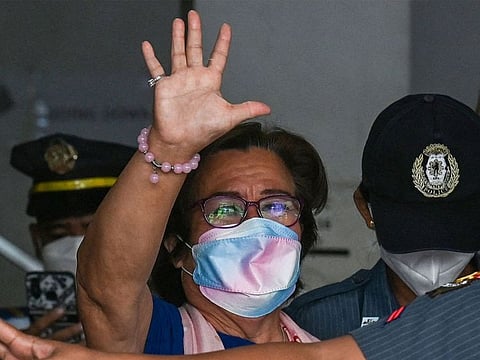 Former Philippine senator and human rights campaigner Leila de Lima (C) leaving after attending her hearing at the Muntinlupa Trial Court in Metro Manila. (File photo)