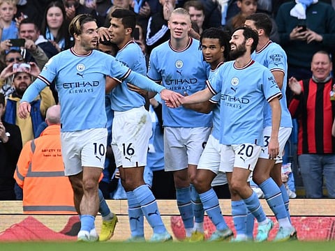 Manchester City's Norwegian striker Erling Haaland (centre) celebrates scoring the team's fourth goal during the English Premier League match against Southampton at the Etihad Stadium in Manchester, north west England.