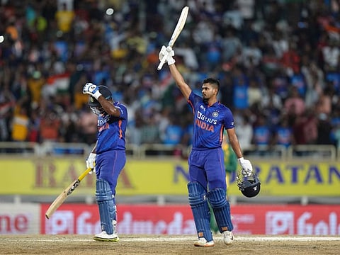 India's Shreyas Iyer raises his bat to celebrate his century during the second one day international cricket match against South Africa, in Ranchi, India.