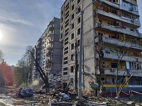 This handout picture taken and released by Ukrainian State Emergency Service on October 9, 2022 shows a residential building damaged after a strike in Zaporizhzhia, amid the Russian attack of Ukraine.