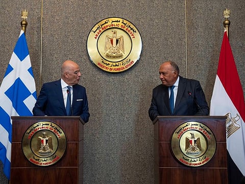 Greek Foreign Minister Nikos Dendias, left, and Egyptian Foreign Minister Sameh Shoukry, hold a joint press conference, at the foreign ministry headquarters in Cairo, Egypt, Sunday, Oct. 9, 2022.