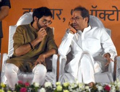 Former Maharashtra Chief Minister and Shiv Sena Chief Uddhav Thackeray interacts with his son and party MLA Aaditya Thackeray during Dussehra rally, at Chhatrapati Shivaji Maharaj Park, Dadar, in Mumbai on Wednesday, October 6, 2022.