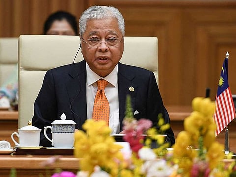 In this file photo taken on March 21, 2022 Malaysia's Prime Minister Ismail Sabri Yaakob attends a bilateral meeting with Vietnam's Prime Minister Pham Minh Chinh at the Government Office in Hanoi.
