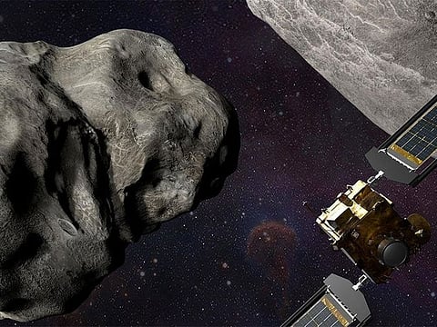 Illustration of NASA’s DART spacecraft and the Italian Space Agency’s (ASI) LICIACube prior to impact at the Didymos binary system.