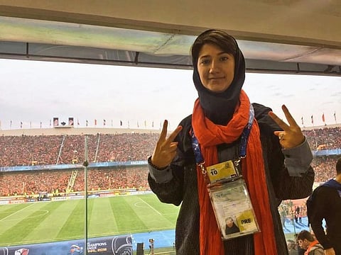 A picture of Niloofar Hamedi reporting at a football match.