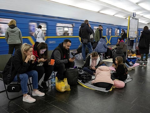 People shelter inside a subway station during a Russian missile attack in Kyiv, Ukraine October 11, 2022.