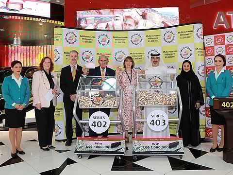 Dubai Duty Free officials announcing the new millionaires at Dubai International Airport on Wednesday