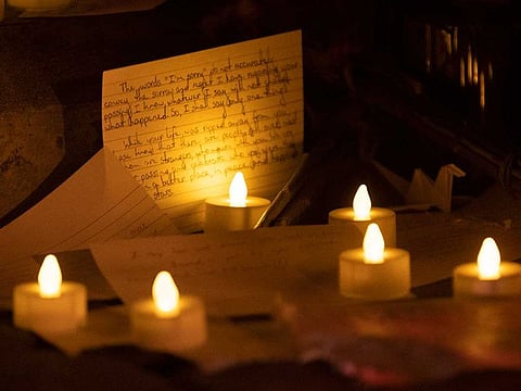 Students leave notes on the 'Unfinished P' during a vigil for Varun Manish Chheda, Wednesday, Oct. 5, 2022, at Purdue University in West Lafayette, Ind.
