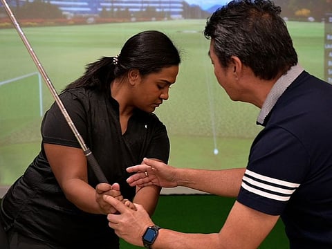 Zenia Wivou (left) with Stephen Hong at MyGolf Dubai.