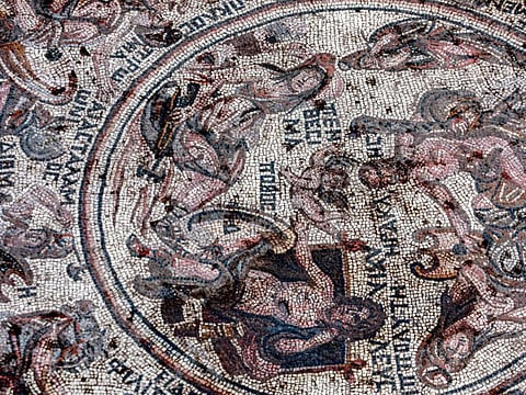 This picture taken on October 12, 2022 shows a view of a mosaic floor dating to the Roman era being excavated in the city of Rastan.