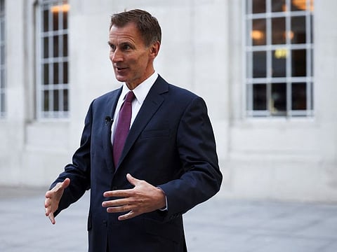 British Chancellor of the Exchequer Jeremy Hunt speaks during an interview with television correspondent Robert Peston outside the BBC headquarters, in London, Britain, October 15, 2022.