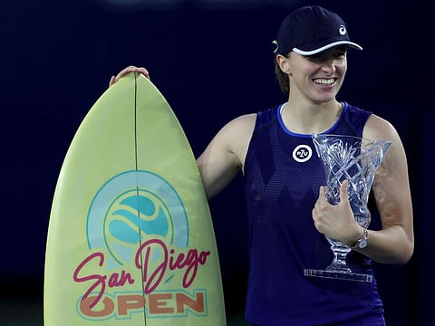 Iga Swiatek of Poland clebebrates with the trophy after defeating Donna Vekic of Czech Republic in the women's singles final during the San Diego Open, part of the Hologic WTA Tour, in San Diego, California.