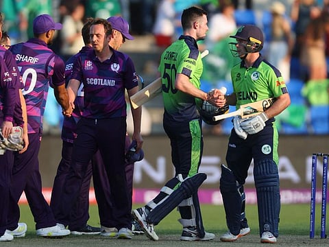 Ireland's Curtis Campher (right) and George Dockrell shake hands at the end of the ICC mens Twenty20 World Cup 2022 cricket match against Scotland at Bellerive Oval in Hobart.