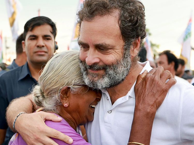 An elderly woman greets Congress leader Rahul Gandhi during the party's Bharat Jodo Yatra