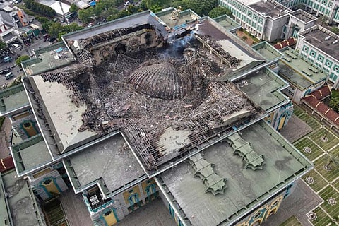 This aerial picture taken on October 20, 2022 shows the smouldering remains of the collapsed dome of the Islamic Centre mosque in Jakarta, which caught fire during ongoing renovation work.