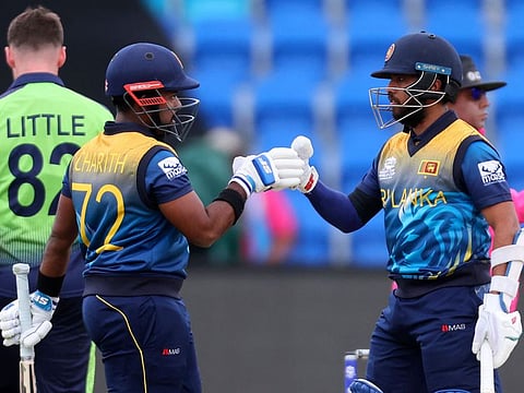 Sri Lanka's Kusal Mendis and Charith Asalanka (left) bump gloves during the ICC men's Twenty20 World Cup 2022 cricket match between Sri Lanka and Ireland at Bellerive Oval in Hobart.