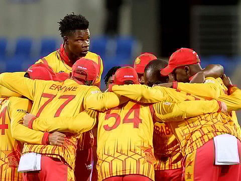 Zimbabwe players huddle during the ICC men's Twenty20 World Cup 2022 cricket match between South Africa and Zimbabwe at Bellerive Oval in Hobart.