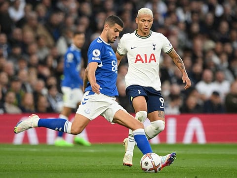 Everton's English defender Conor Coady (left) fights for the ball with Tottenham Hotspur's Brazilian striker Richarlison during the English Premier League match at Tottenham Hotspur Stadium in London.