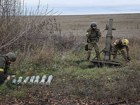 Ukrainian servicemen prepare to fire a mortar on a front line, as Russia's attack on Ukraine continues, in Kharkiv region, Ukraine October 25, 2022.