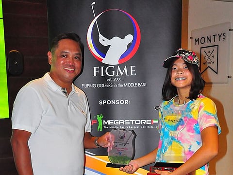 Alessa Chang (right), winner of the recent FIGME Club Championship at the Montgomerie Golf Club with FIGME Chairman Ramon Navea (left).