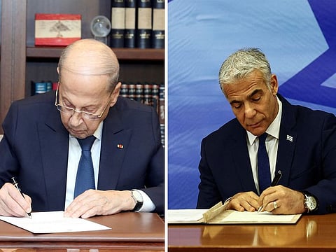 Lebanese President Michel Aoun and Israeli Prime Minister Yair Lapid sign the maritime deal in Beirut and Jerusalem, respectively, on Thursday.