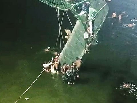 Rescue operation under way after a cable bridge collapsed in the Machchhu river, in Morbi, Gujarat, on October 30.