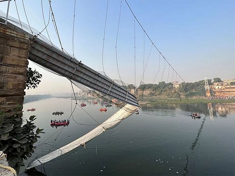 Rescuers search for survivors after a suspension bridge collapsed in Morbi town in the western state of Gujarat, India, October 31, 2022.