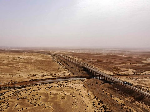 This aerial view shows what remains of the dried up Hamrin artificial lake that received water from the Sirwan river, a tributary of the Tigris, in the Dyala province northeast of Baghdad, on May 20, 2022.