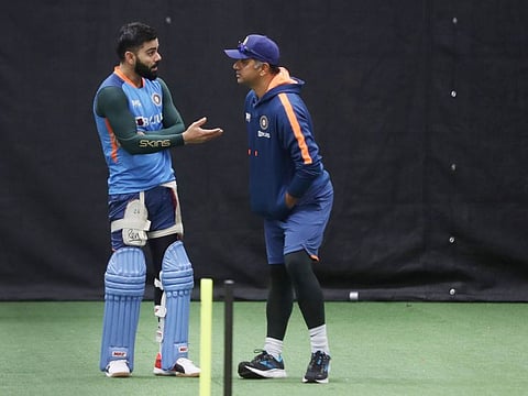 Star Indian batter Virat Kohli interacts with head coach Rahul Dravid during a practice session ahead of the match against Bangladesh at Adelaide Oval on Tuesday. Team India were forced to practice indoor due to rains.