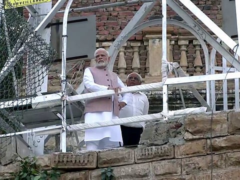 Prime Minister Narendra Modi with Gujarat Chief Minister Bhupendra Patel reviews the search and rescue operation that are underway after the cable bridge collapsed in the Machchhu river, in Morbi on Tuesday, Nov 1, 2022.