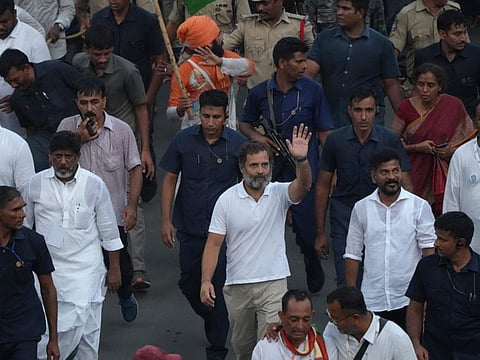 Congress party leader Rahul Gandhi, centre, waves as he walks with other leaders during his months long Bharat Jodo Yatra or Unite India March, in Hyderabad, India, Tuesday, Nov. 1, 2022.