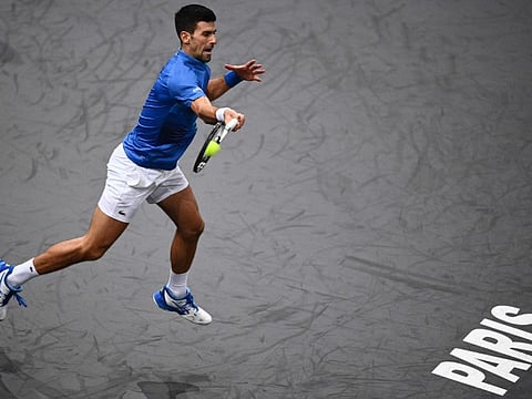 Serbia's Novak Djokovic plays a forehand return during the men's singles match against US' Maxime Cressy on day two of the ATP World Tour Masters 1000 - Paris Masters (Paris Bercy) - indoor tennis tournament at The AccorHotels Arena in Paris.